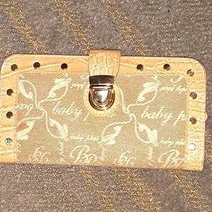 Gently used BabyPhat 6.5x3.5 thin fold studded wallet has slight discoloration